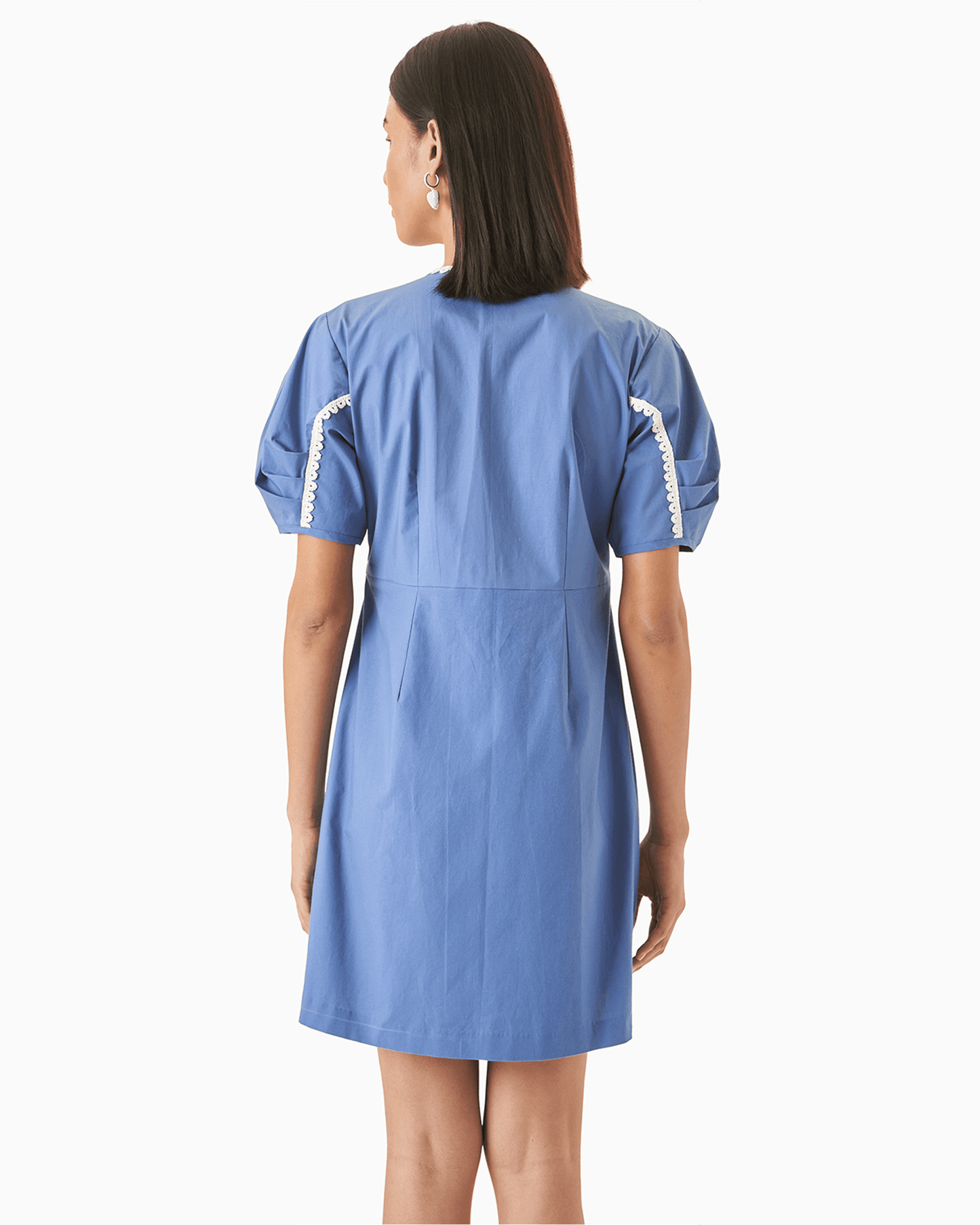 Back view of Daffodil Dress - Blue Cotton Dress highlighting clean tailoring, puff sleeves with lace trim, and a straight-cut back.